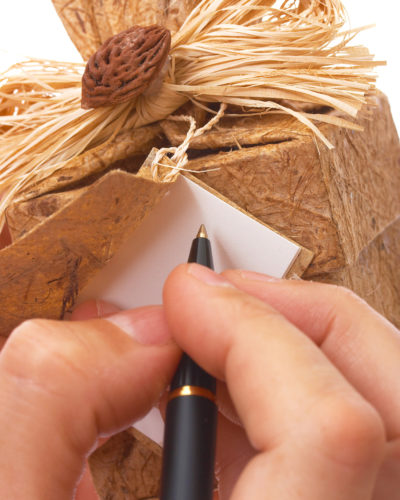 Sausage Fingers writing a message on a Vancouver gift basket!